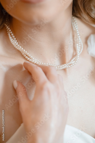 Elegant Pearl Necklace on Bride During Wedding Day Preparation