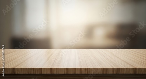 Empty wooden tabletop with blurred bright room background.