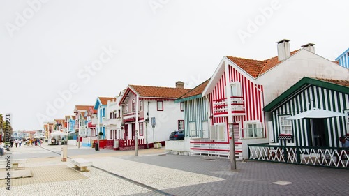 A slow panning shot showing the famous traditional colorful striped houses on the coast of Costa Nova in Portugal. 24.05.2026