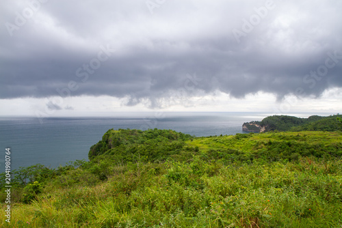 Dramatic Storm Clouds Over Tropical Coastal Cliffs in Indonesia