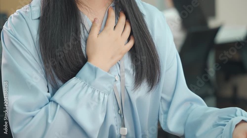 Office worker woman hands massage chest pain sudden difficulty breathing possibly due to heart problems, panic attack, anxiety, asthma, cardiac arrest, stress or stroke, breathing issue in health risk