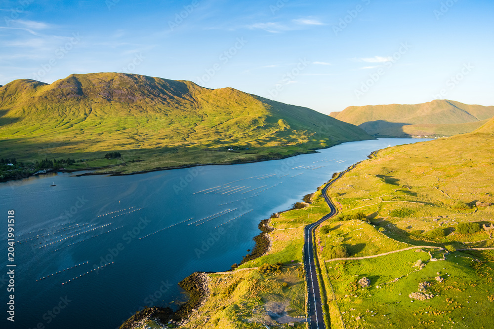 Fototapeta premium Aerial view of Killary Fjord near Leenane on the Galway Mayo border, Ireland. Irelands only fjord winds through the dramatic Connemara and Mayo mountain landscape.