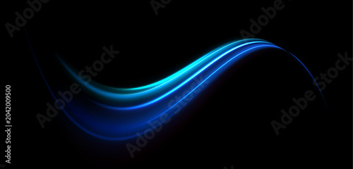 Fotografie Bright blue waves of light form an abstract motion trail in space
