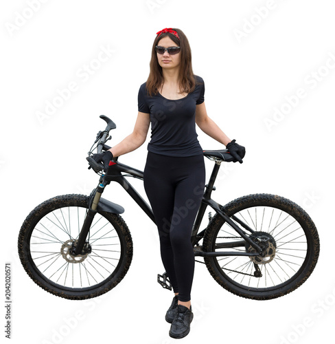 Girl on a mountain bike on offroad, beautiful portrait of a cyclist in rainy weather, Fitness girl rides a modern carbon fiber mountain bike in sportswear. Close-up portrait of a girl in red bandana.