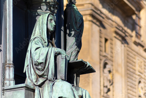 Bilde på lerret Detailed close-up of the Neo-Gothic bronze allegorical statue representing a university faculty on the Charles IV Monument, Prague