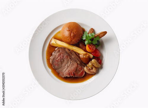 Roast Beef with Vegetables and Gravy on White Plate Top View