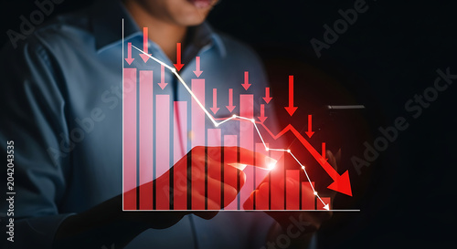 Business professional analyzing financial data hologram with futuristic technology in dark office