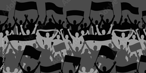 A large crowd of people waves flags in a lively protest event downtown.