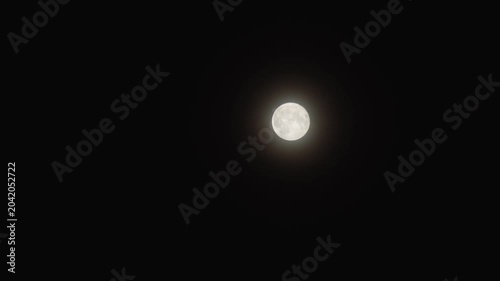 Full moon shining on a night sky