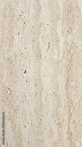 Natural beige travertine stone texture background with porous details