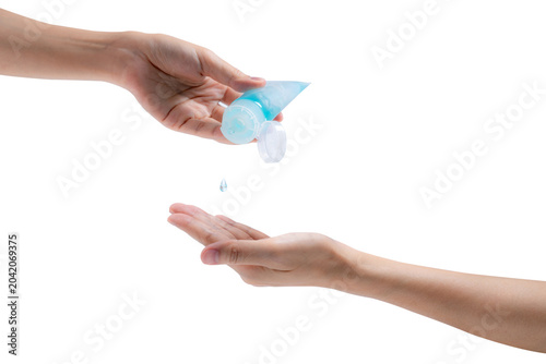Fotografie Woman hand holding hand sanitizer and drop on customer palm to kill coronavirus
