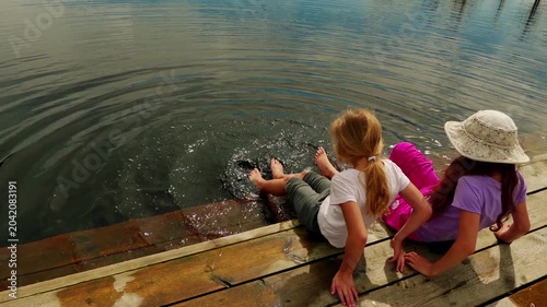 Two girls walk on Swamp Viru Raba in Estonia