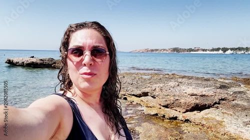 Tourist Woman Admiring Clear Waters of Vouliagmeni Lake Beach.