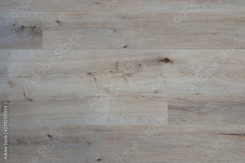 top view of a clean light wooden floor texture, natural laminate or parquet planks background with copy space