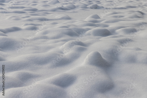 Bild auf Leinwand details of a large number of shallow snowdrifts of white color, soft and fluffy
