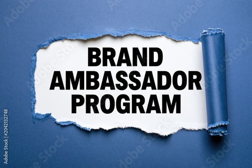 Brand ambassador program printed on white paper under blue layer