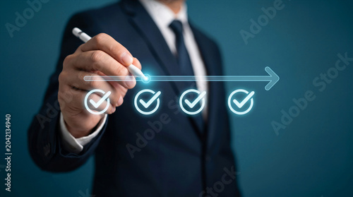 Businessman drawing a digital timeline with checkmarks, ideal for business strategy, goal tracking, and success concepts