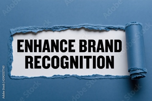 enhance brand recognition text written on white background under torn dark blue paper