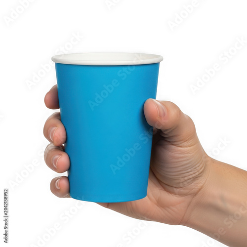 Hand holding blue disposable paper cup with white lid, hot beverage container isolated on transparent background.