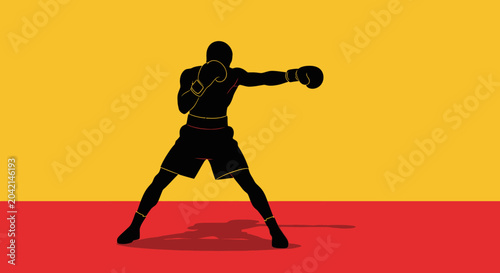 Photos Silhouette of a boxer throwing a punch against a vibrant yellow and red backgrou