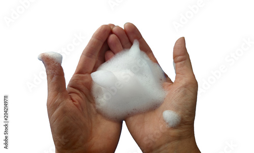 Tableau sur toile Two hands holding a mound of white soap foam, with bubbles visible, isolated on