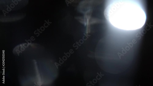 Cinematic light leak transition background with glowing abstract particles and flare movement