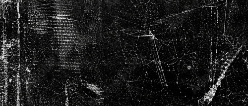 Grungy distressed texture with scratches and noise during a low key lighting