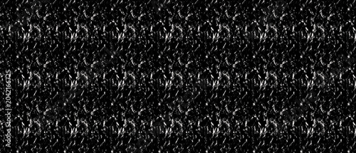 Abstract textured pattern with metallic sheen and subtle sparkle during studio lighting