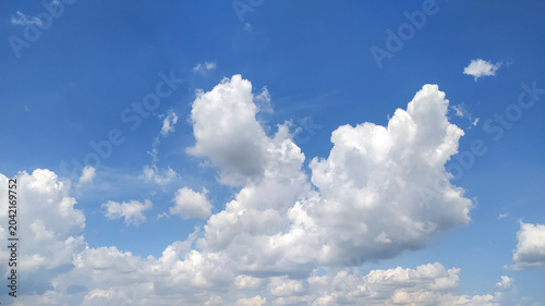 Blue sky with white clouds stock photo.