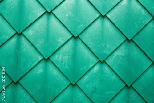 Diamond shaped fish scale tiled wall texture background