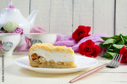 Freshly baked apple pie with smooth soufflé cream topping. Baked dessert with apples and a light creamy texture