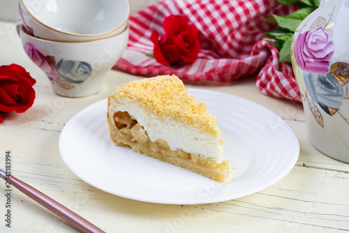 Freshly baked apple pie with smooth soufflé cream topping. Baked dessert with apples and a light creamy texture