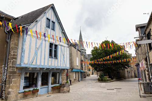 Photos Typical architectural style of a side street with houses and shops in Guerande,