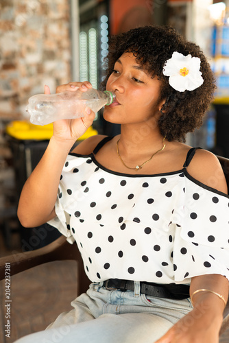 Fotografía Woman drinking water from bottle for hydration and refreshment