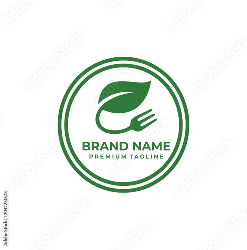 Modern healthy dining logo displaying curved fork attached to leaf.