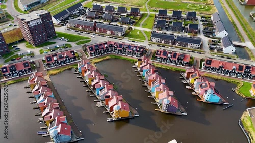 Drone aerial view of reitdiephaven groningen colorfull houses at the water