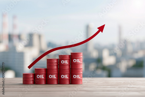 Red oil drums stack upward with bold arrow trending higher. City skyline softly blurred in background, hinting global scale. Bright daylight enhances visual clarity and professional tone
