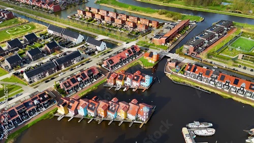 Drone aerial view of reitdiephaven groningen colorfull houses at the water