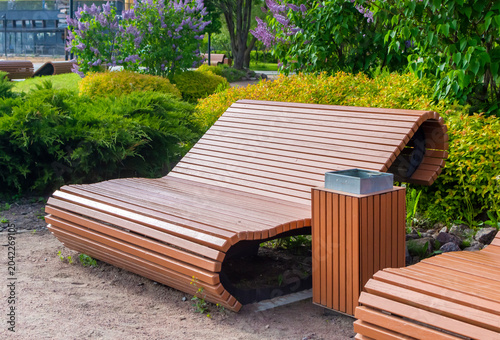 Modern wooden park benches. Landscape design.