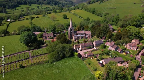 Aerial drone push in shot of St Michael and All Angels Church in Hathersage