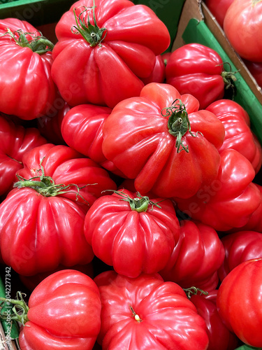 Pile of Fresh Heirloom Tomatoes at a Market