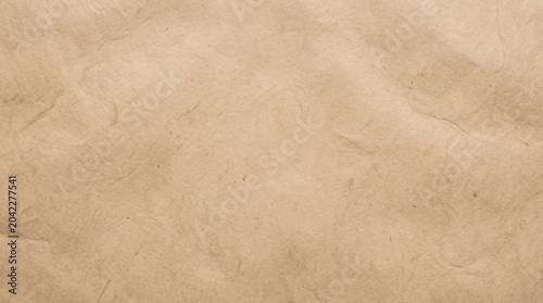 Crumpled brown paper texture wrinkled material background