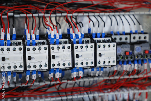 Foto Electrical contactors and wiring inside industrial control panel
