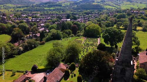 Aerial drone shot revealing Hathersage village from St Michael and All Angels Church spire