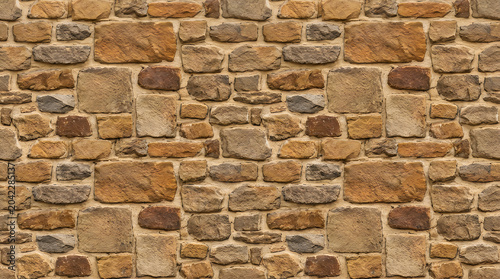 Background texture of brown rustic stone wall with natural rock pattern for vintage urban architectural wallpaper and professional outdoor backdrop design 4k high res surface pattern