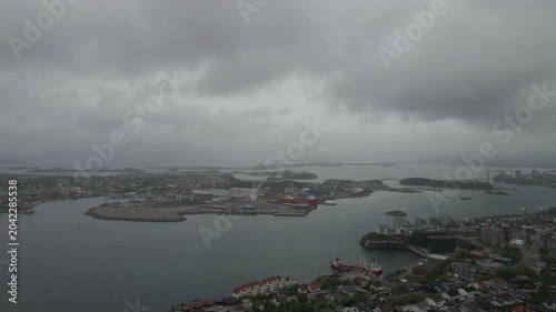 This high-quality aerial drone footage captures a quiet residential neighborhood on the outskirts of Stavanger, Norway. Filmed during the midday hours under a soft, overcast sky.