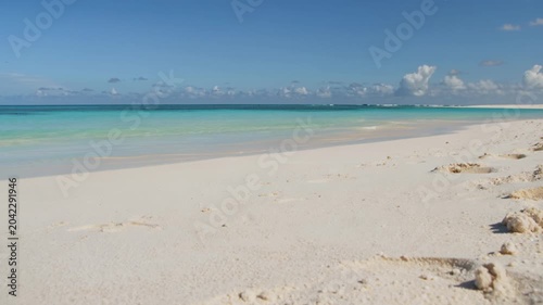 Low Angle Shot of Pristine Tropical Beach and Turquoise Ocean Illustrating Serenity and Relaxation