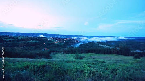 Demirkoy floodplain forest landscape at night. Panoramic view of natural lush green wetland scenery with mysterious foggy clouds during twilight hours for ecological environmental background