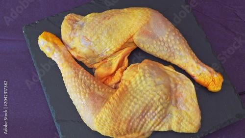 Raw chicken legs on tray for cooking
