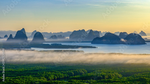 Cuadro en lienzo Breathtaking sunrise view over limestone islands in Phang Nga Bay with sea of mist covering lush mangrove forest, Samet Nangshe viewpoint, Thailand